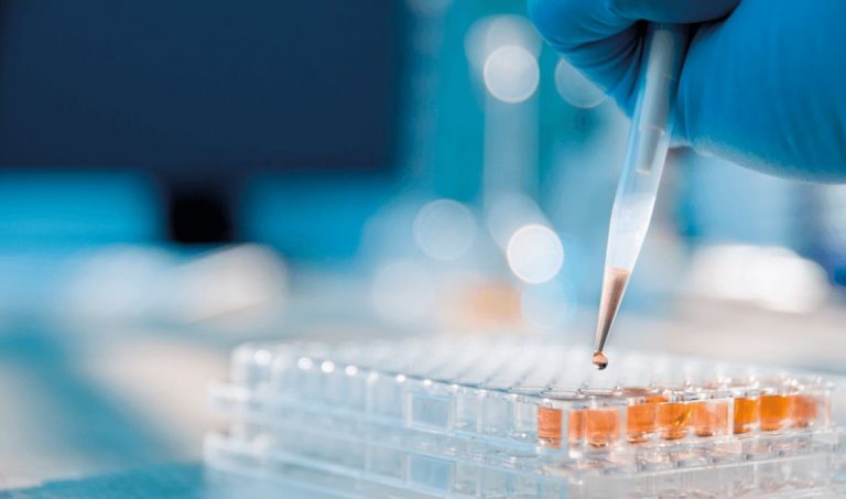 Hands demonstrating accurate pipetting technique using a micropipette for precise liquid measurement in a lab